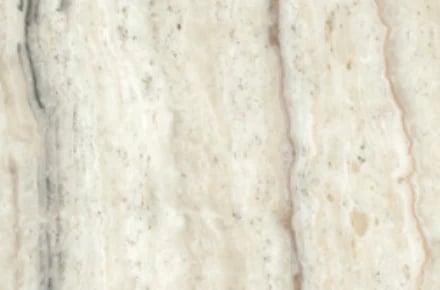 Close-up of cream and beige marble or stone texture with natural veining and variation