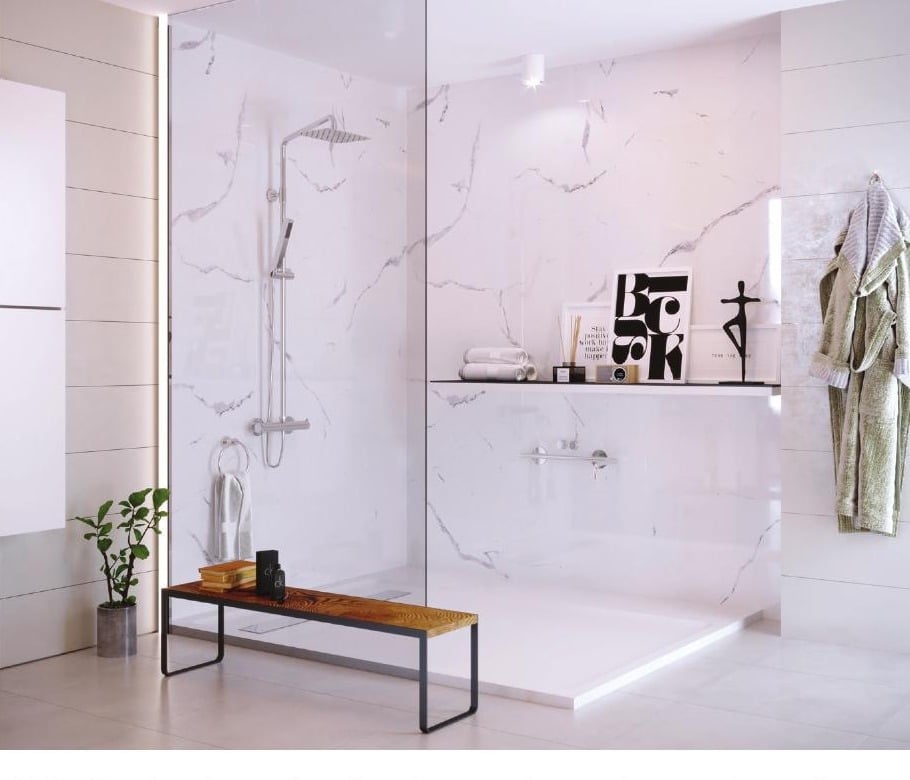 Modern bathroom with marble-patterned shower enclosure, glass door, wooden bench, floating shelf, and minimalist decor